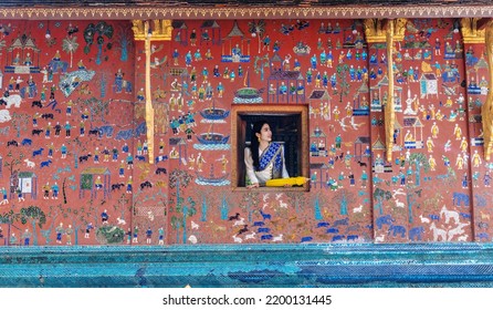 Asian Woman Wearing A Lao National Costume Visits Wat Xieng Thong One Of The Most Famous Attraction Place In Luang Prabang