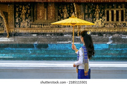 Asian Woman Wearing Laos Traditional At Wat Xieng Thong (Golden City Temple) In Luang Prabang, Laos.