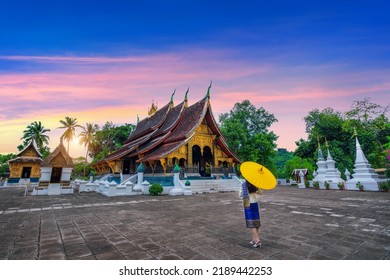 Asian Woman Wearing Laos Traditional At Wat Xieng Thong (Golden City Temple) In Luang Prabang, Laos.