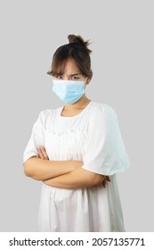 Asian Woman Wearing Mask To Protect Herself From COVID-19