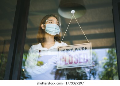 Asian Woman Wearing Mask Store Owner Turning Hanging CLOSED Sign In Front Door To Open The Shop Social Distancing New Normal