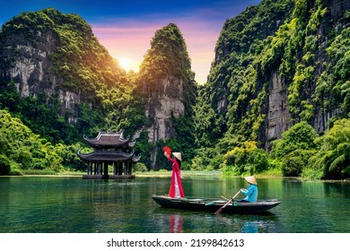 Asian woman wearing Vietnam culture traditional at Trang An, Vietnam. - Shutterstock ID 2199842613