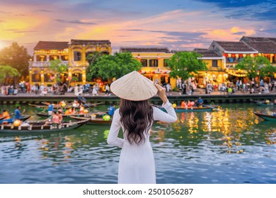 Asian woman wearing vietnam culture traditional at Hoi An ancient town,Hoi an city in Vietnam. - Powered by Shutterstock