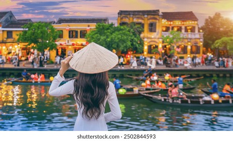 Asian woman wearing vietnam culture traditional at Hoi An ancient town,Hoi an city in Vietnam. - Powered by Shutterstock