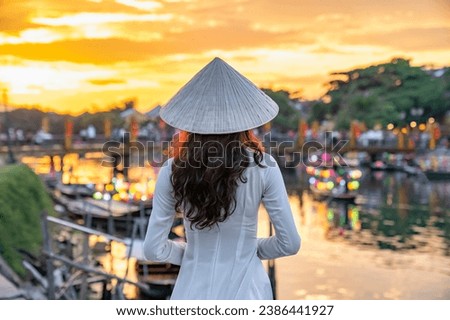 Asian woman wearing vietnam culture traditional at Hoi An ancient town, Vietnam. Hoi An is one of the most popular destinations in Vietnam  from Korea, Thailand, USA, Japan, China