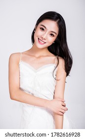 Asian woman in white dresses
