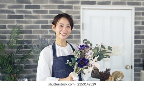 Asian Woman Working In Flower Shop. Flower Coordinator. Flower Arrangement.