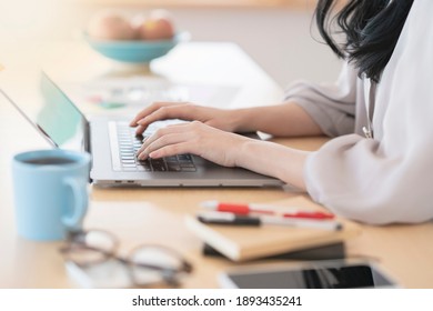 Asian woman working from home - Shutterstock ID 1893435241