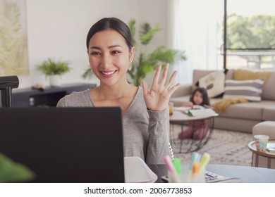 Asian Woman Working From Home With Child, Remote Learning, Zoom Online Class, Homeschooling, Stay Home, Social Distancing During Covid Pandemic , Freelance Job, New Normal Concept