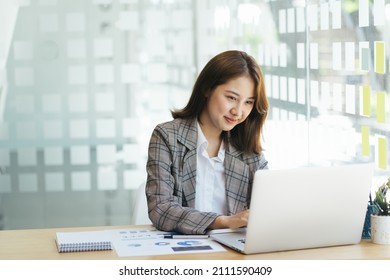 Asian woman working laptop computer Working in the office and laptop concept Young Asian woman starting business using laptop computer 