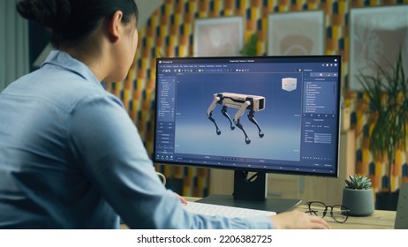 Asian woman working on pc in 3D modeling program remotely from home office and creating 3D prototype of modern robot - Powered by Shutterstock