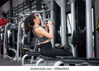 Asian Woman Workout Close Grip Lat Pull Down In Fitness Gym