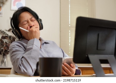 Asian Woman Yawn When Video Conference Meeting At Home