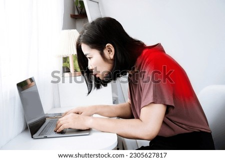 Asian woman's back and shoulder pain with incorrect posture while working on a computer and potential Kyphosis