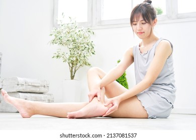 Asian Woman's Body Care Of Her Heel