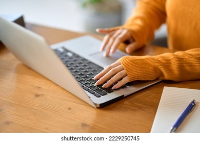 Asian woman's hand surfing the net - Shutterstock ID 2229250745