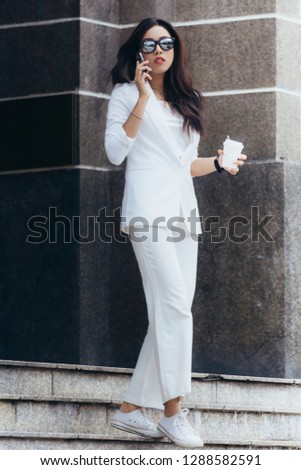 Asian women are beautiful businesswoman, Asian business people office worker talking on smartphone.