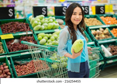 Asian Women Are Buying Supermarket Vegetables