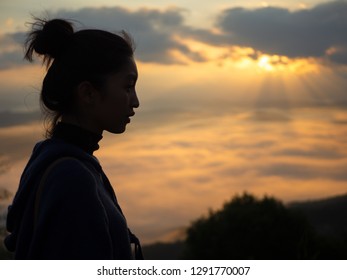 Asian women with camera Travel Holiday Relaxation Concept , Vintage Style,sunrise clouds on top of rocky mountain with misty - Shutterstock ID 1291770007