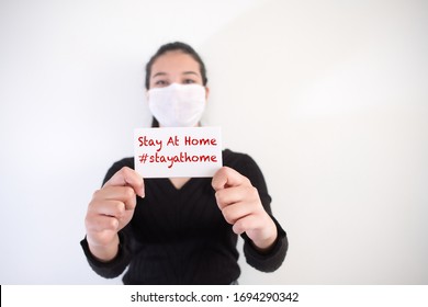 Asian Women Doctor Wearing A Protective Face Mask Against Coronavirus. Quarantine Days At Home. Stay At Home.