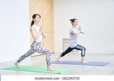 Asian Women Doing Yoga Indoor