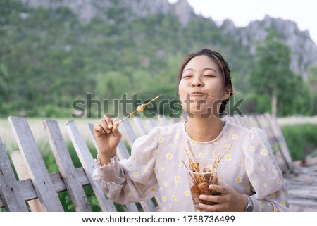 Asian women eating delicious food