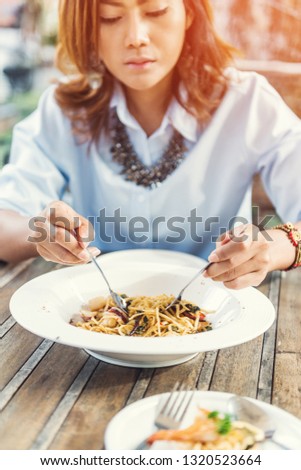 Asian women eating delicious,Focus on food
