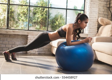 Asian Women Exercise At Home She Acted Plank On The Ball.