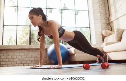 Asian women exercise indoor at home she is acted "push up"