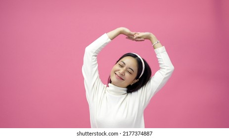 Asian Women Exercise And Sport Woman Stretch On Morning, Preparing For Workout On Pink Background