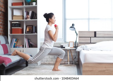 Asian women exercising in bed in the morning, she feels refreshed.She acts as squat. - Powered by Shutterstock