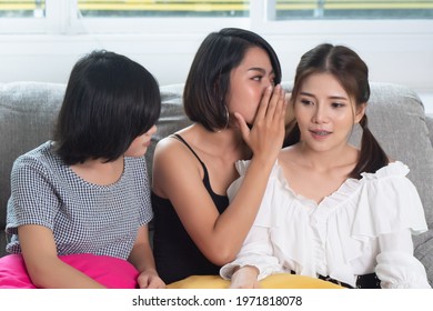 asian women gossiping and whispering, concept of rumor, gossip, hearsay, bad news, social media network fake news, news update, April fool's day concept - Powered by Shutterstock