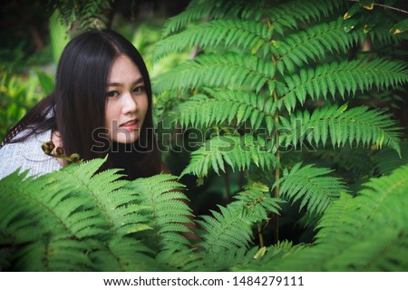 Asian Women in Green Forest in Thailand. 