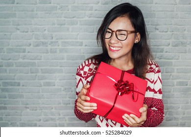 Asian Women Are Happy To Receive A Gift Box In The Festival, Focus On Face.