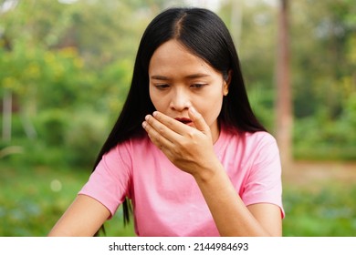 Asian Women Has An Itchy Nose.