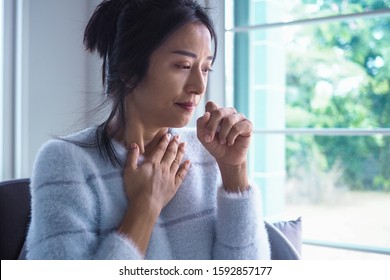 Asian Women Have Angina, High Fever And Chronic Cough. Tuberculosis Symptoms