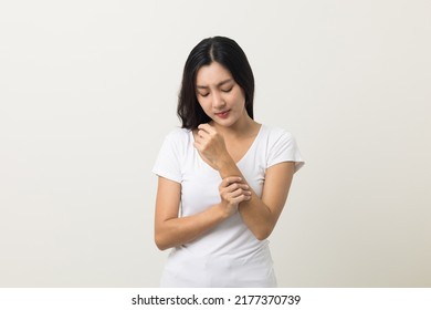 Asian women have skin problems She felt irritation on her skin. Skin infection itching red rash scratching with hands. She around 25 Wearing white shirt standing on isolate background - Shutterstock ID 2177370739
