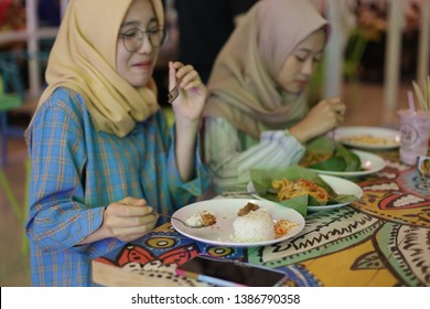 Asian Women Hijab Eating Food Nasi Lemak Or Nasi Padang. Yogyakarta Indonesia. May 02, 2019.