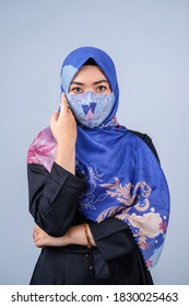 Asian Women With Hijab And Fashionable Face Mask Posing Look To Camera Against Grey Background