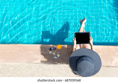 Asian Women Lifestyle At Hotel Play Laptop And Relaxing Near Luxury Swimming Pool Sunbath, Summer Day Near The Beach Resort, Copy Space.  Summer Concept.
