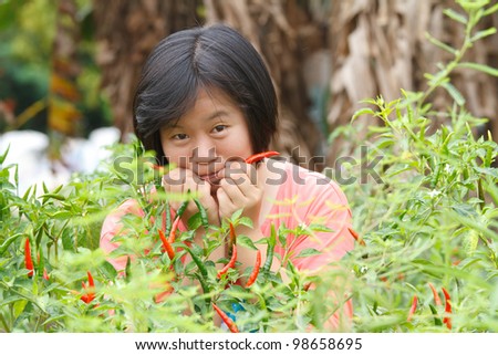 Asian women in pepper plant.