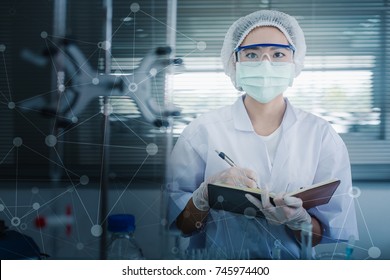 Asian women scientist with test tube making research in clinical laboratory.Science, chemistry, technology, biology and people concept