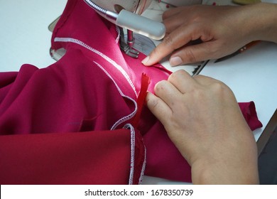 Asian women sew clothes at home to prevent spreading of Covid-19