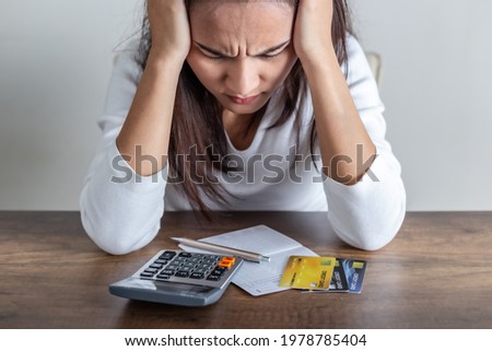Asian women are stressed out of going into credit card debt.