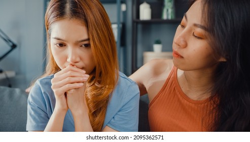 Asian Women Teenager Embracing To Calm Her Sad Best Friends From Feeling Down From Breakup With Boyfriend In Living Room At Home. Friendship Counseling And Care, Unhappy Girl Support Her Girlfriend.