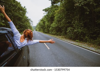 Asian Women Travel Relax In The Holiday. Traveling By Car Park. Happily With Nature, Rural Forest. In The Summer. Woman Driving A Car Traveling Happily.