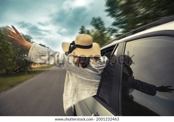 Asian women\
travel relax in the holiday in\
car\
