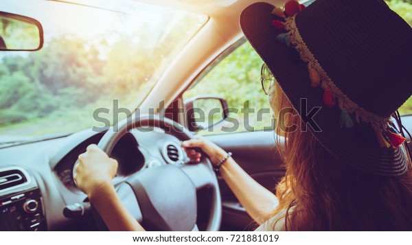 Asian women travel relax in the holiday. drive a\
car\
Happy travel