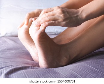 Asian Women Use Hands Massage On Toes With Numbness Nerves And Foot Pain.