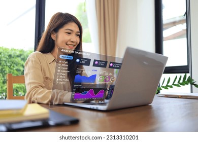 Asian women is using laptops to analysis the business with virtual analytic dashboard collect data and analytics for accurate precision customer in digital marketing. Online marketing global business - Powered by Shutterstock